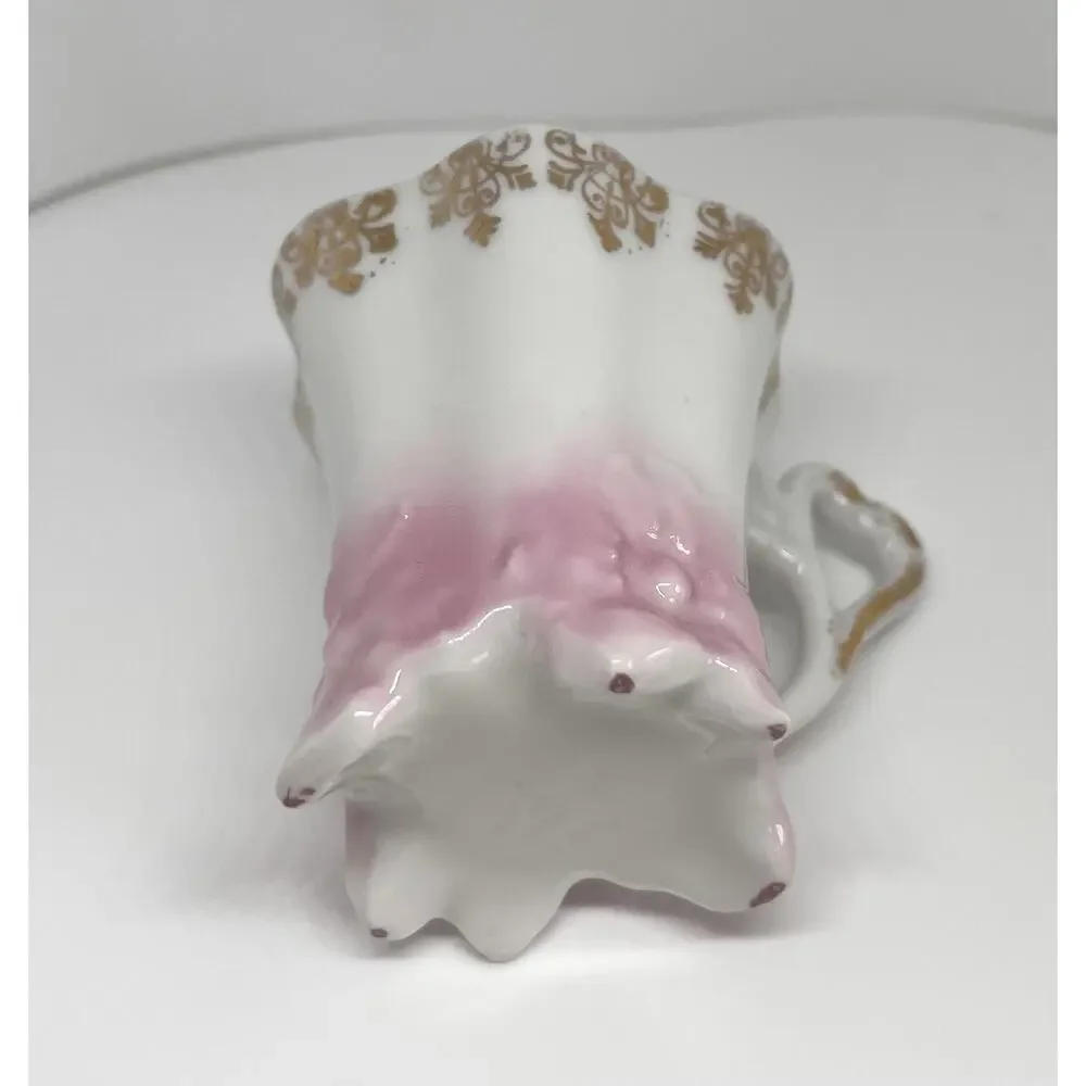 Antique Footed Teacup And Saucer